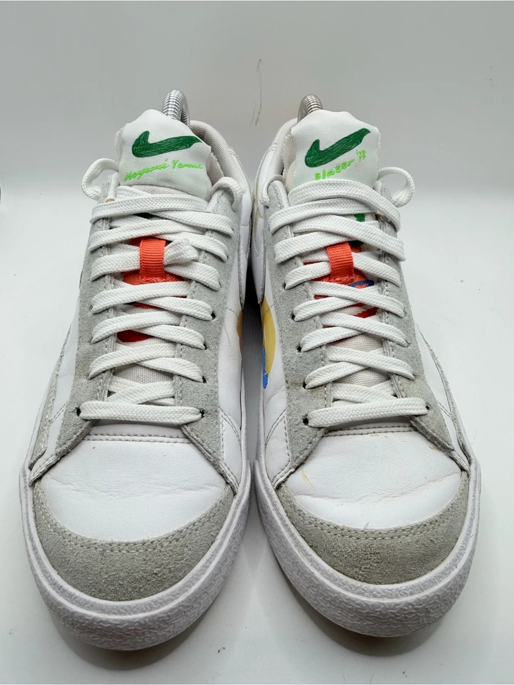 Nike White Low-Top Sneakers with Blue, Green, Yellow and Orange Accents